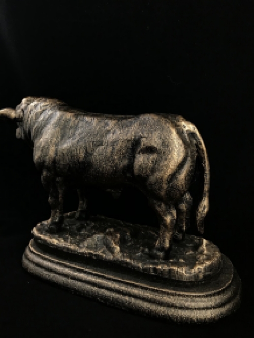 A beautiful statue of a bull, made of cast iron