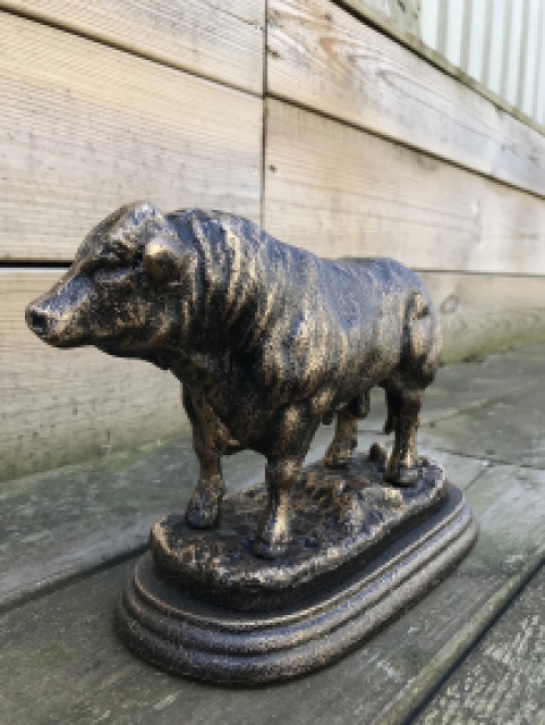 A beautiful statue of a bull, made of cast iron