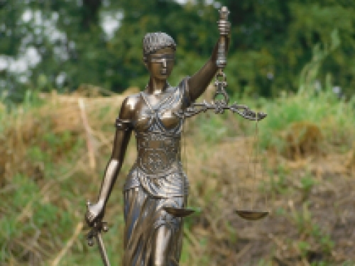 A large statue of Lady Justice, bronze-look, very beautiful!