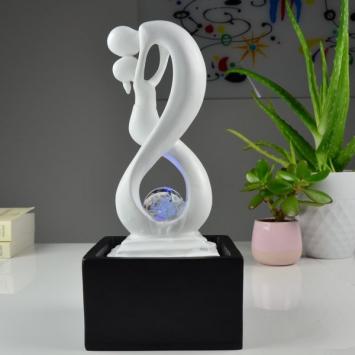Indoor fountain, abstract sculpture with water ornament
