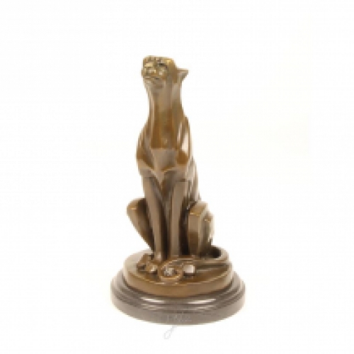 A bronze statue/sculpture of a sitting Cheetah