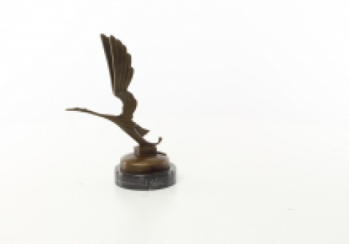 A bronze statue/sculpture of a stork figure