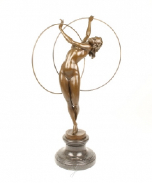 A bronze statue/sculpture of a naked hula hoop dancer