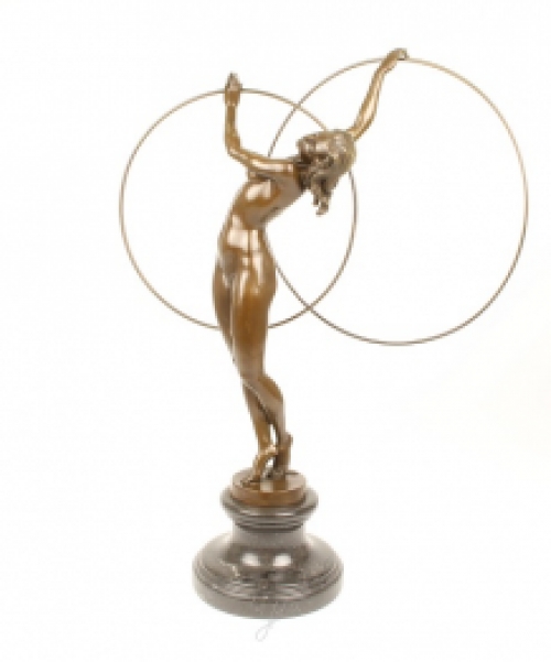 A bronze statue/sculpture of a naked hula hoop dancer