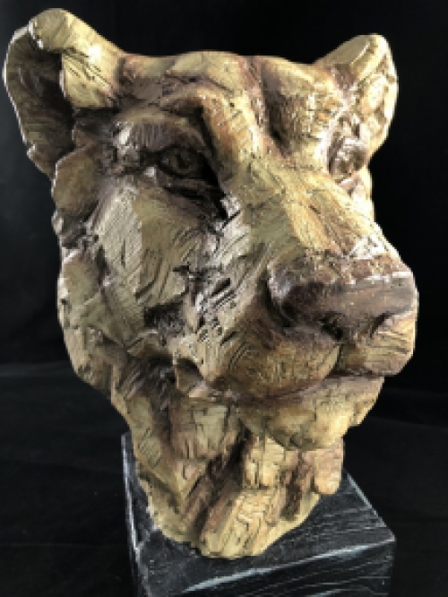 A beautiful head of a lion, beautiful in detail, polystone wood look