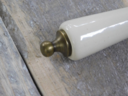 1 door handle brass with antique white ceramic handle, with mandrel.