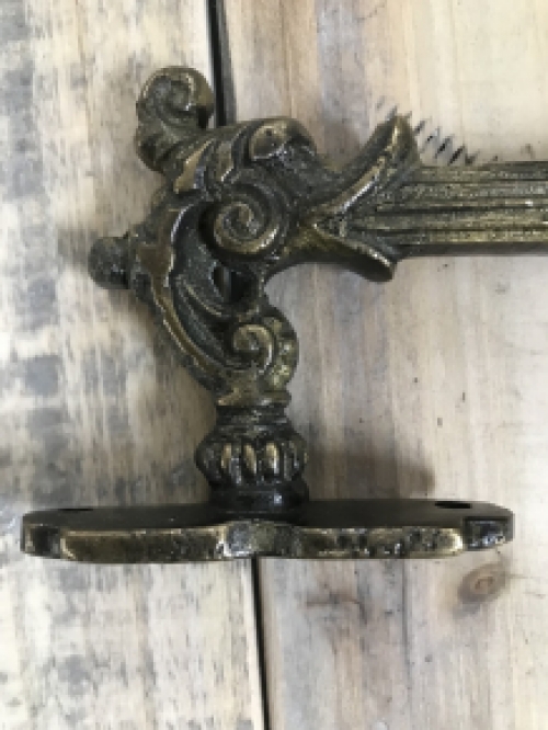 Door handle, cabinet handle, founder time, made of iron, brass patinated