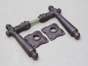 Set of door handles - including rosettes - iron - red/brown rusted