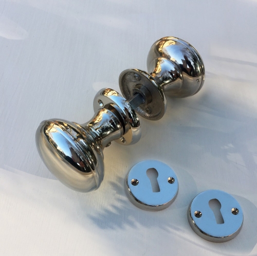 Dubbele deurknop - gepolijst nikkel - inclusief rozetten