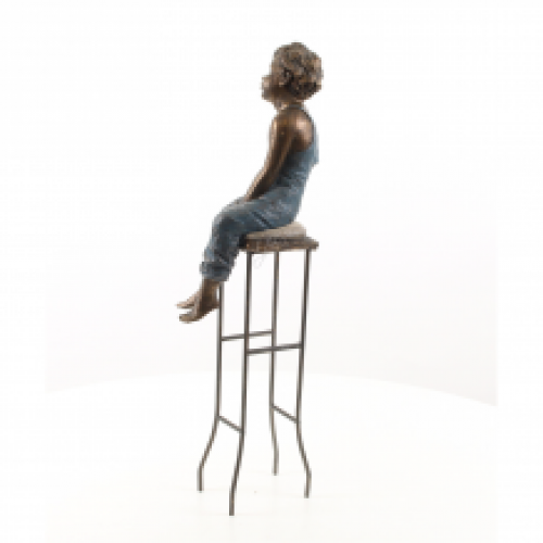 Polystone statue of a small young boy on a chair