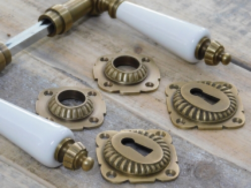 Set of door handles with rosettes - patinated brass 