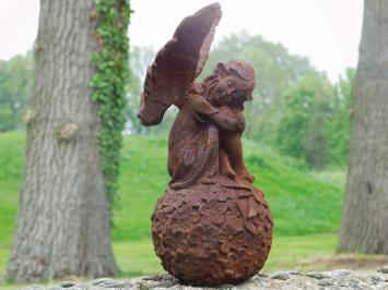 Angel on globe - cast iron