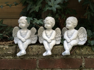 Small sitting Angel made of solid stone, beautiful to see!!