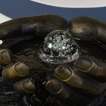 Indoor fountain, hands as bowl, illuminated water ornament