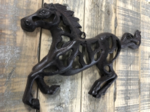 Wall ornament abstract image of a running horse, cast iron brown.