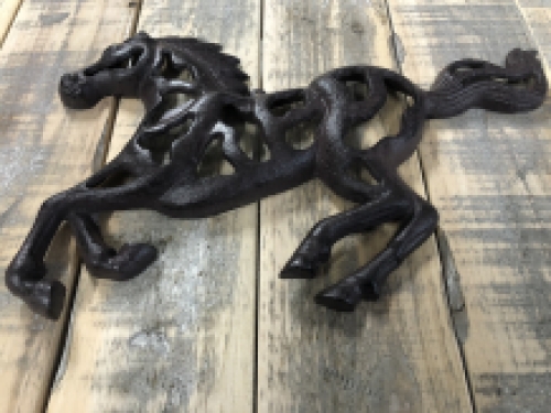 Wall ornament abstract image of a running horse, cast iron brown.