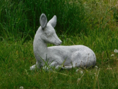 Statue of a deer lying down - solid stone