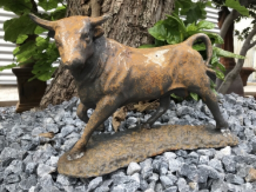 A beautiful statue of a bull, cast iron rest