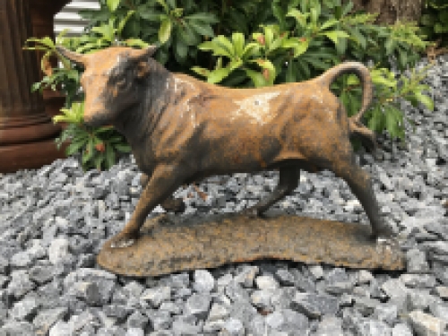 A beautiful statue of a bull, cast iron rest