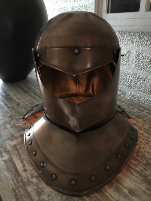 Knight's helmet copper, with folding visor.