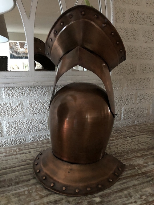 Knight's helmet copper, with folding visor.