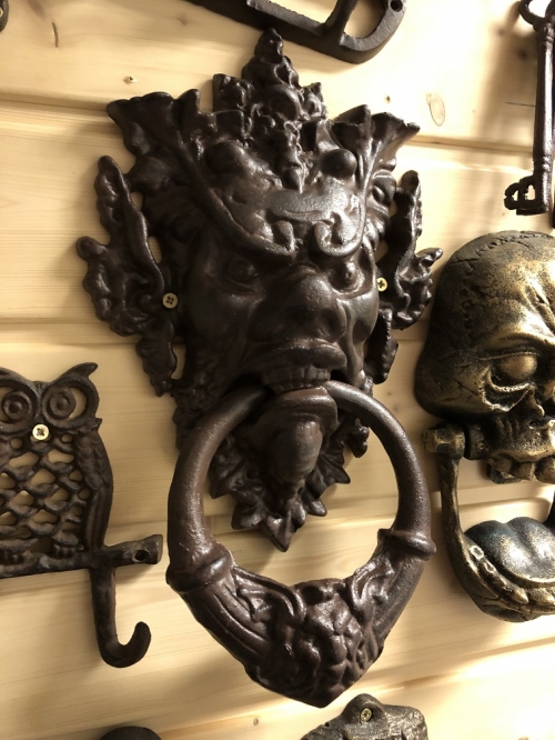 Cast iron door knocker with devil's head-dark brown, very distinctive!