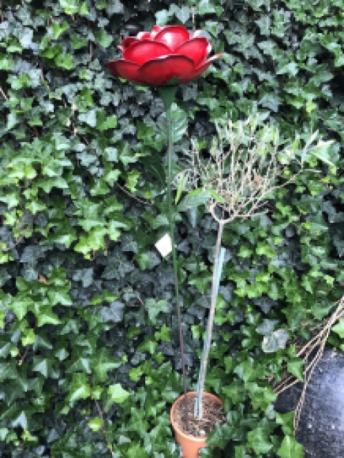 A work of art, this large rose made entirely of metal.