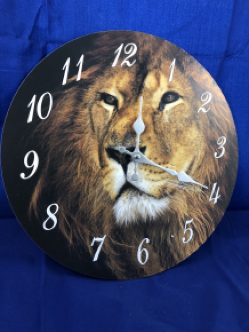 Wooden clock with image of a lion.