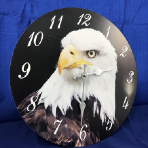 Wooden clock with an image of an eagle.