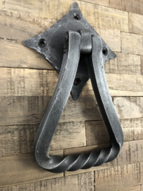 Door knocker wrought iron for on rustic wooden door, nice tough design.