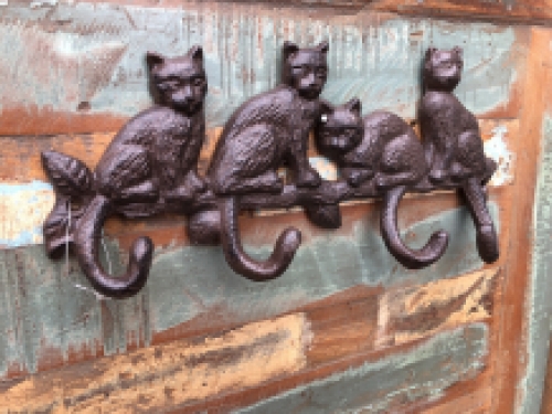 Coat rack with 4 cats and the hooks are the tails, great!