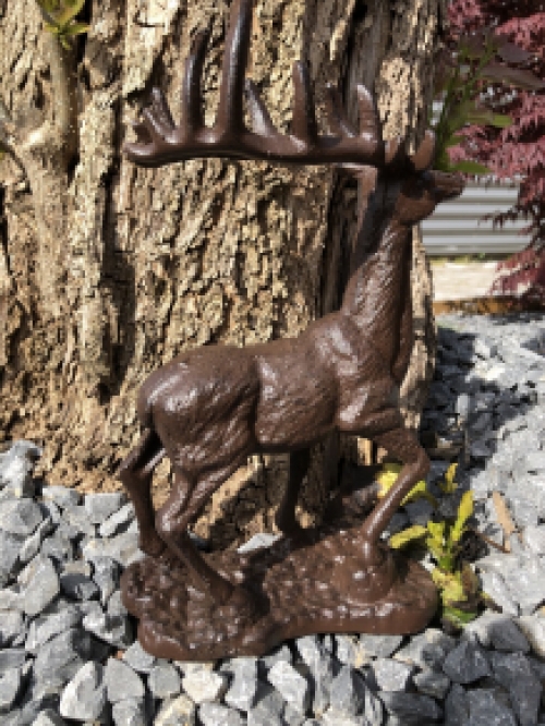 Beautiful cast iron deer on stand.