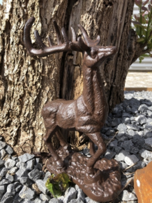 Beautiful cast iron deer on stand.