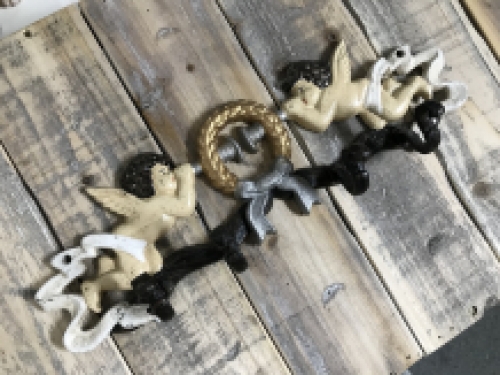 Coat rack with angel, in cast iron and in color