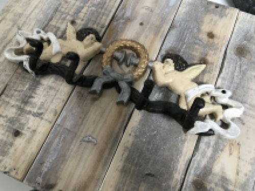 Coat rack with angel, in cast iron and in color