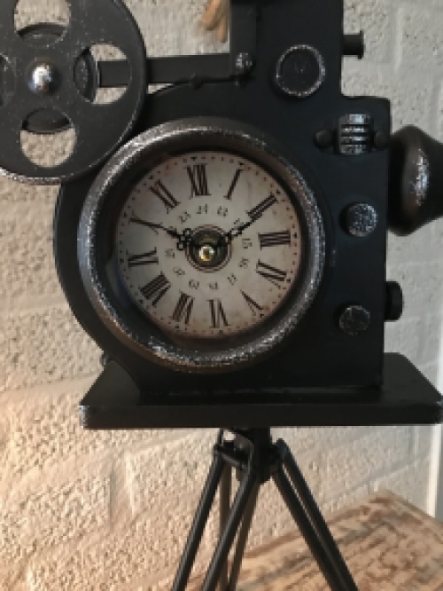 A nostalgic and decorative clock in the shape of an old film camera