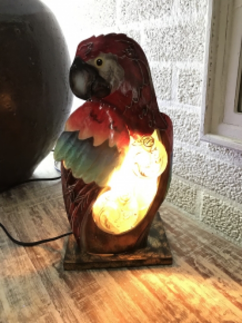 A metal lamp in the shape of a parrot, very beautiful!