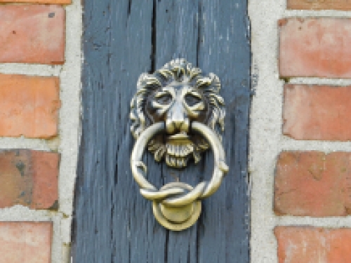 Doorknocker lion, antique iron - black/brass colour