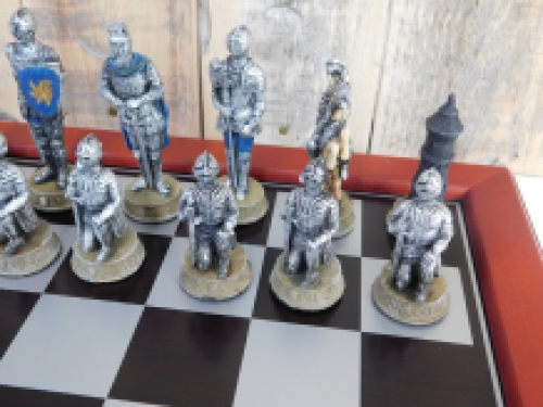 A chess game with the theme: ''MEDIEVAL KNIGHTS'', beautiful chess pieces as medieval knights