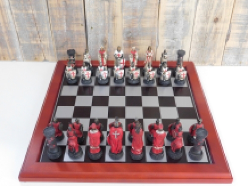 A chess game with the theme: ''MEDIEVAL KNIGHTS'', beautiful chess pieces like medieval knights on a wooden chessboard.