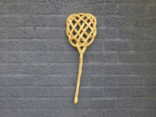 Old-fashioned carpet beater