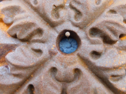 Wall anchor, cast iron, rust brown, leaf shape.