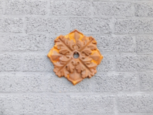 Wall anchor, cast iron, rust brown, leaf shape.