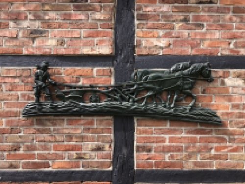 Wall decoration XXL , aluminium green fireplace plate farmer with horse and plough.