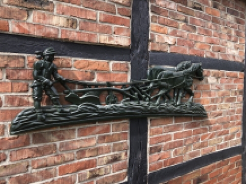 Wall decoration XXL , aluminium green fireplace plate farmer with horse and plough.