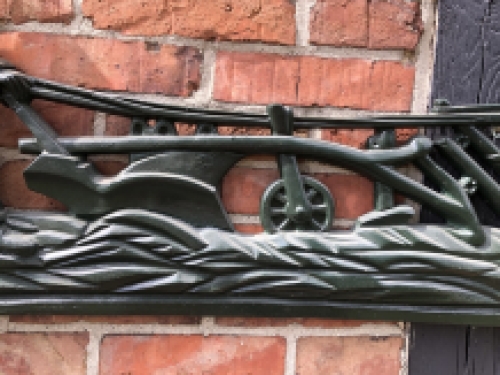 Wall decoration XXL , aluminium green fireplace plate farmer with horse and plough.
