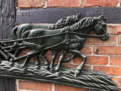 Wall decoration XXL , aluminium green fireplace plate farmer with horse and plough.