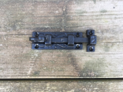 A beautiful door latch / slide lock, matte black, made of wrought iron