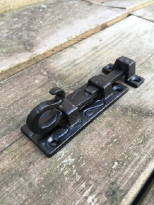 A beautiful door latch / slide lock, matte black, made of wrought iron