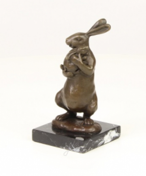 A bronze statue/sculpture of a rabbit with a cub